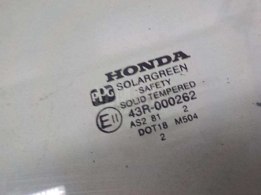 Стекло двери передней левой