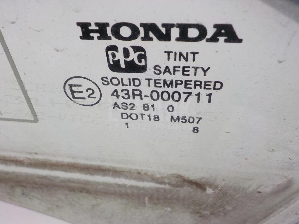 Стекло двери передней левой