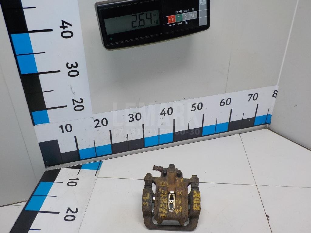 Суппорт тормозной задний левый