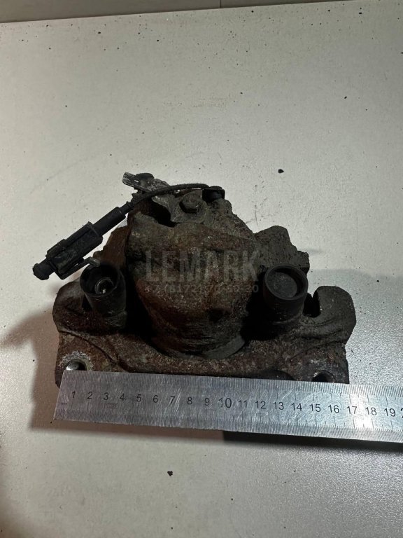 Суппорт тормозной передний левый