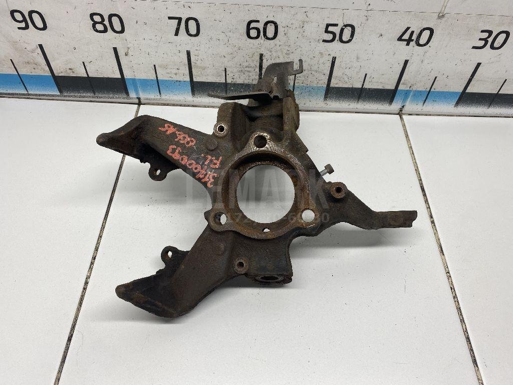 Кулак поворотный передний левый