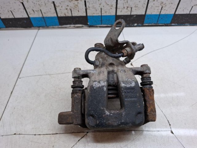 Суппорт тормозной задний левый