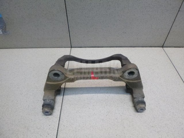 Скоба суппорта переднего левого