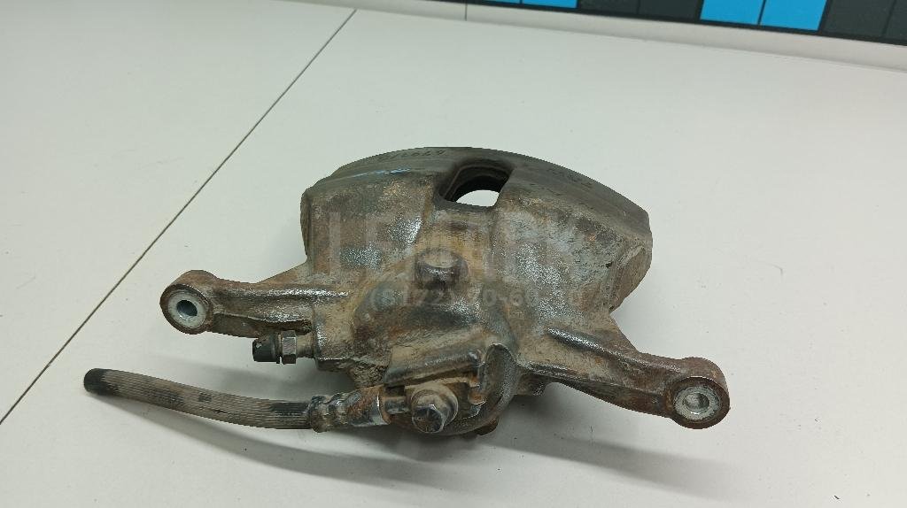 Суппорт тормозной передний левый