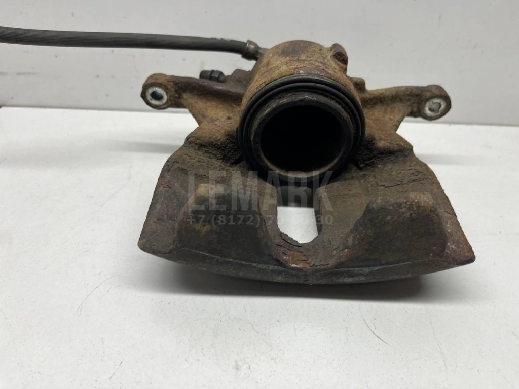 Суппорт тормозной передний левый