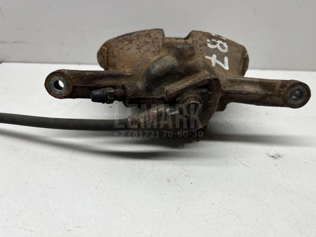 Суппорт тормозной передний левый