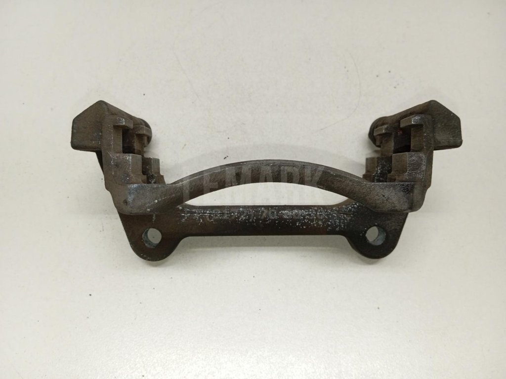 Скоба суппорта переднего левого