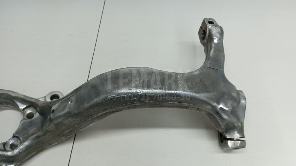 Кулак поворотный передний левый