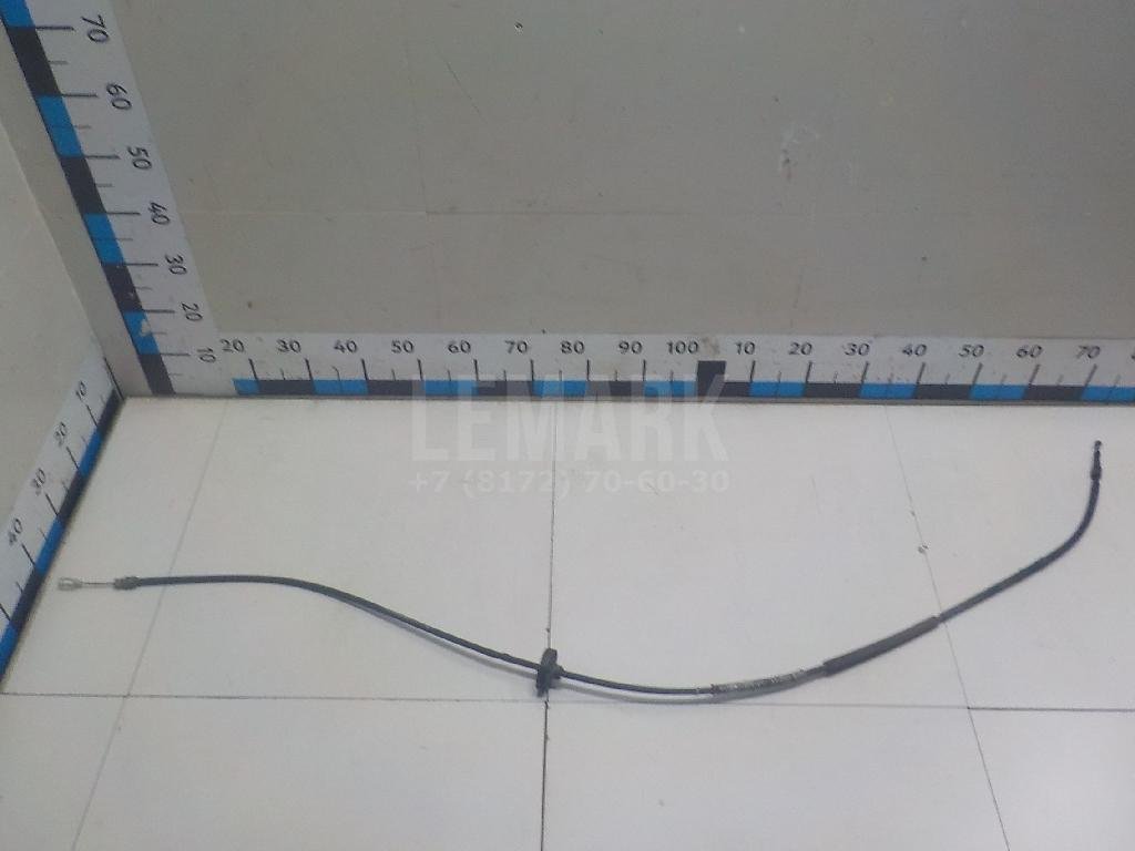 Трос стояночного тормоза левый