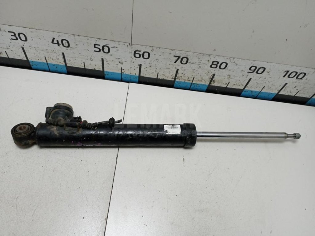 Амортизатор задний левый