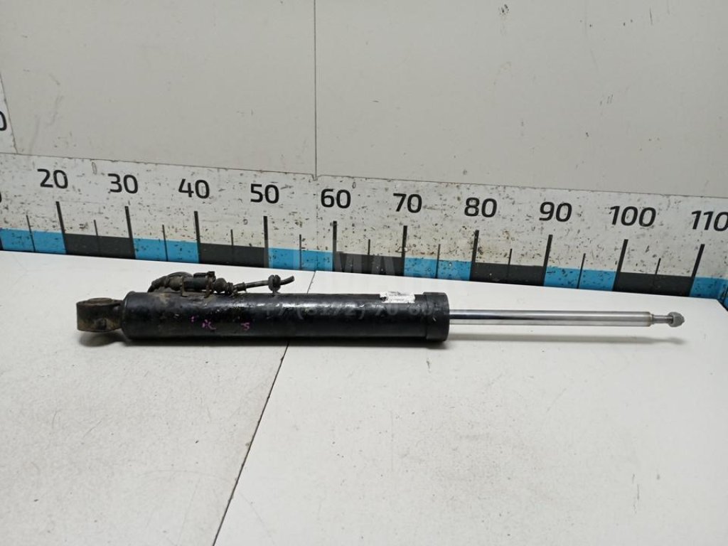 Амортизатор задний левый