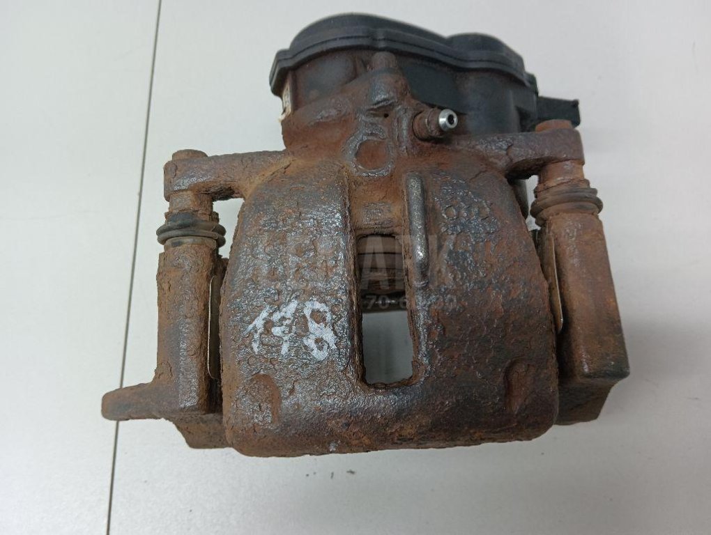 Суппорт тормозной задний левый