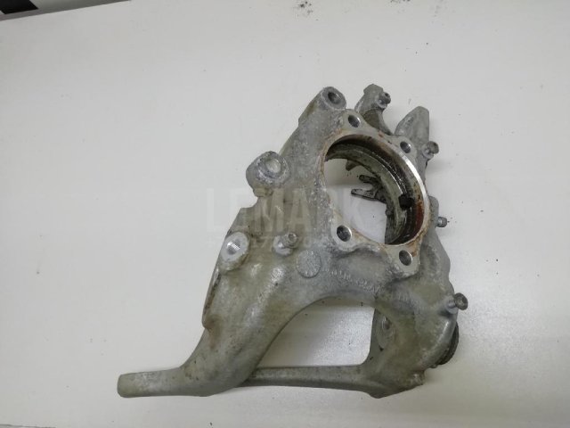 Кулак поворотный задний левый