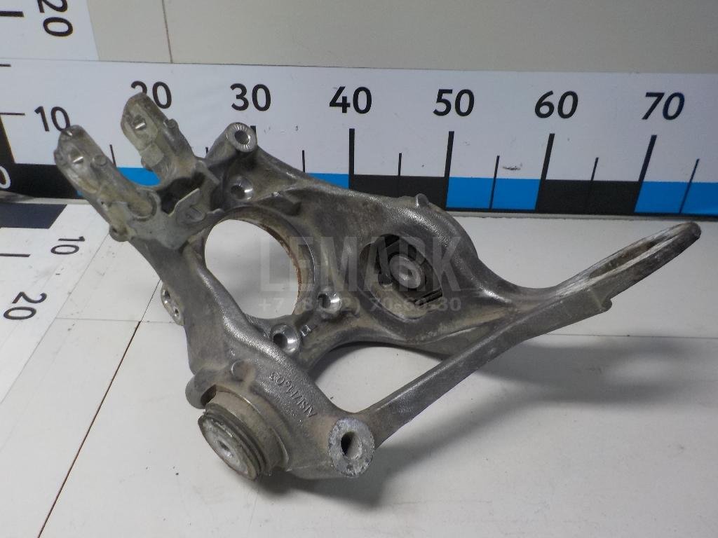 Кулак поворотный задний левый