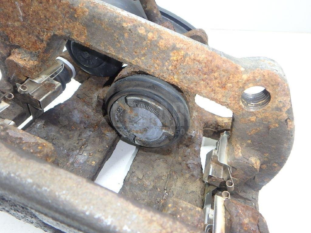 Суппорт тормозной задний левый