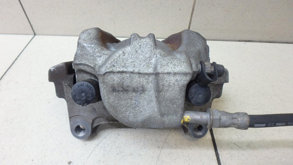 Суппорт тормозной передний левый