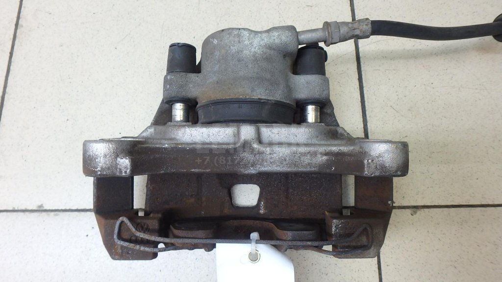 Суппорт тормозной передний левый