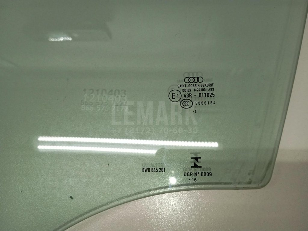 Стекло двери передней левой