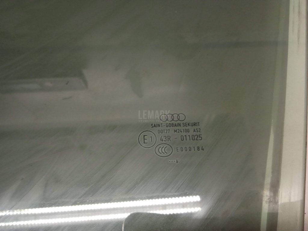 Стекло двери передней левой