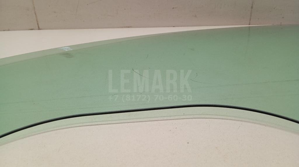 Стекло двери передней левой