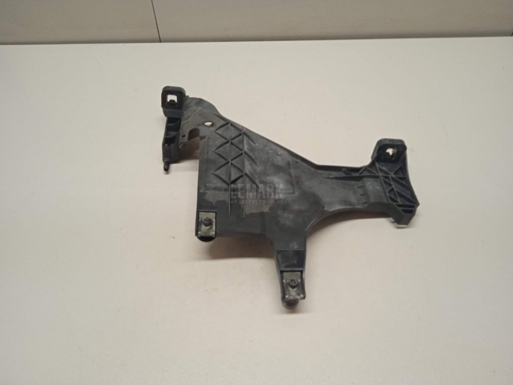 Кронштейн фар левый