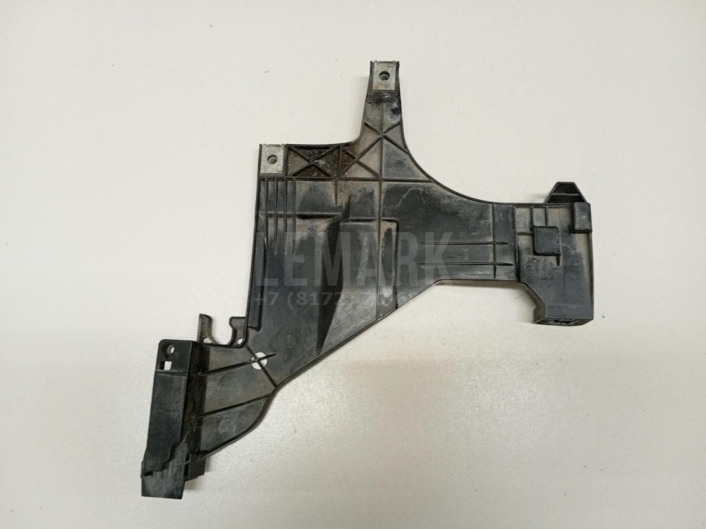 Кронштейн фар левый