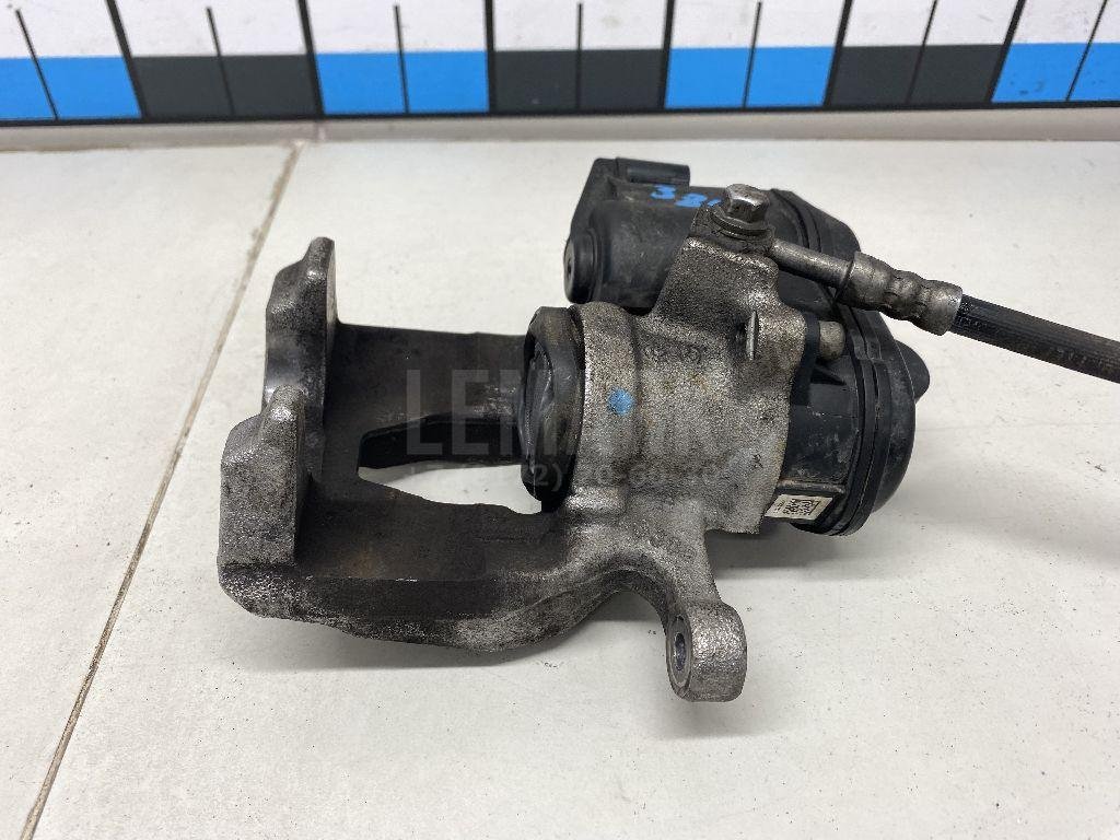 Суппорт тормозной задний левый