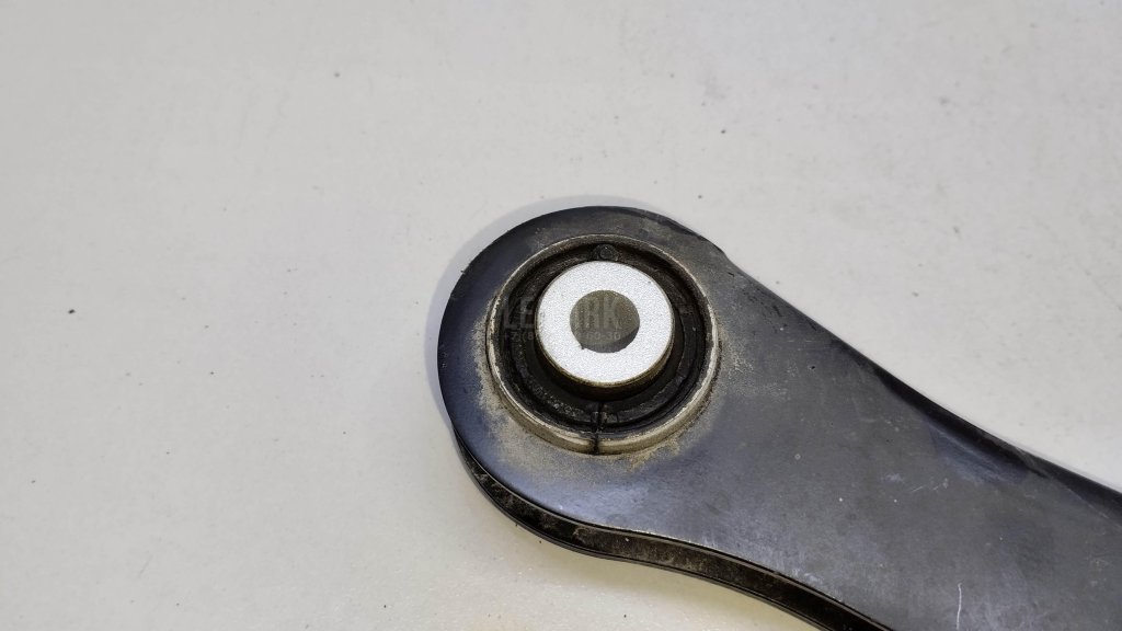 Рычаг задний верхний левый