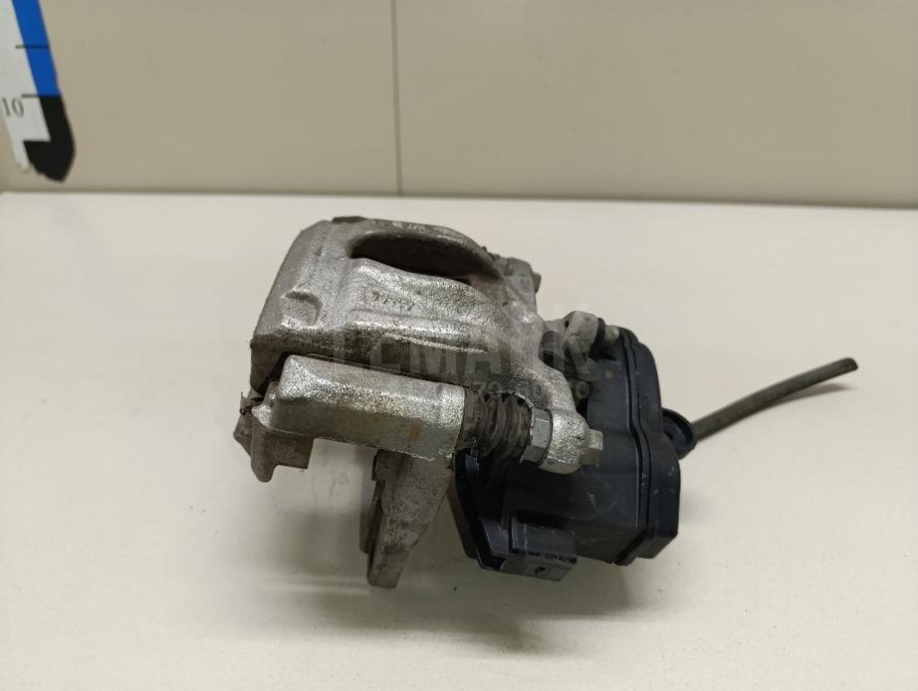 Суппорт тормозной задний левый