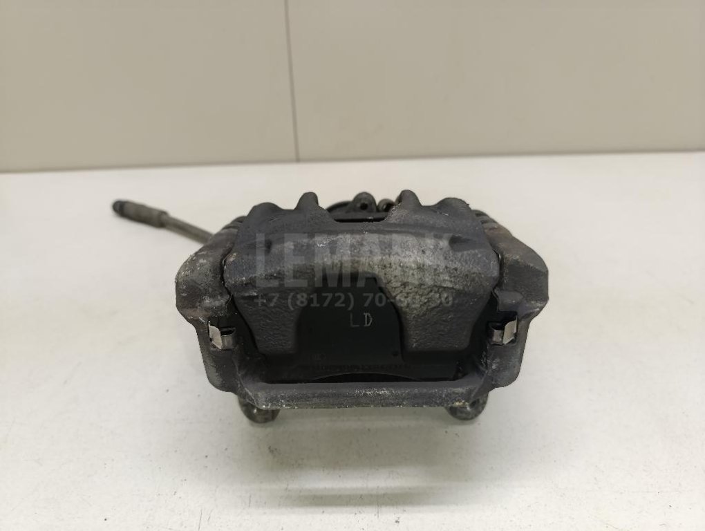 Суппорт тормозной задний левый