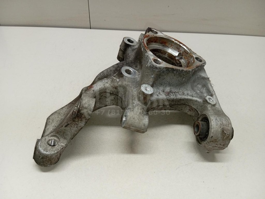 Кулак поворотный задний левый