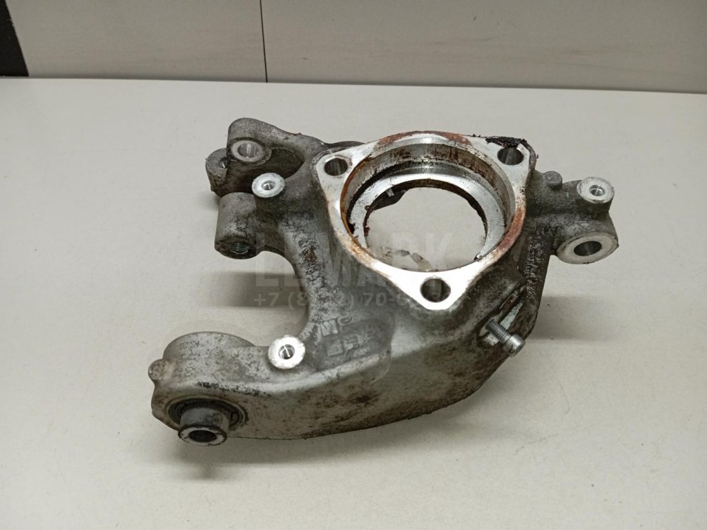 Кулак поворотный задний левый