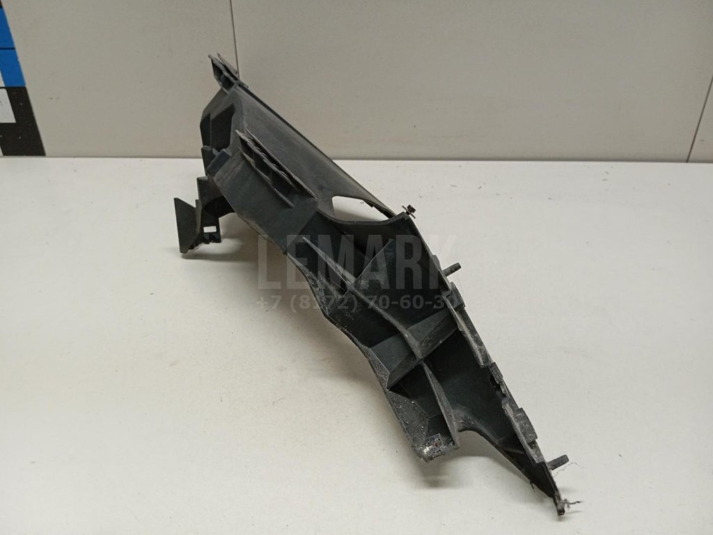 Кронштейн фар левый