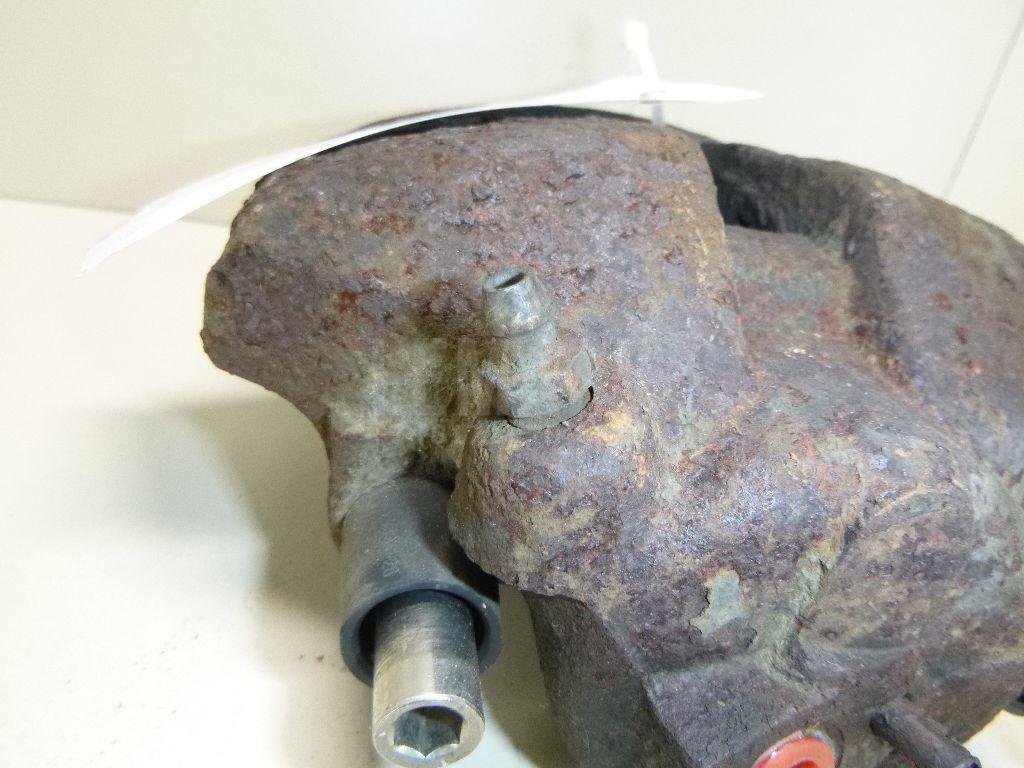 Суппорт тормозной передний левый